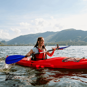 Woman in kayak on lake. Used on craft insurance page.