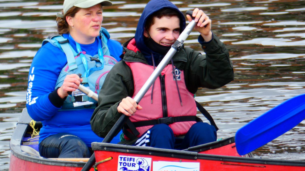 A woman and a young man in a canoe as part of the All Aboard Watersports project
