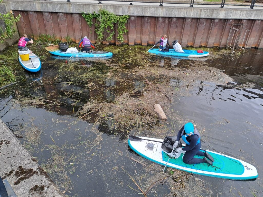 Paddlers in Leeds cleaning up a canal
