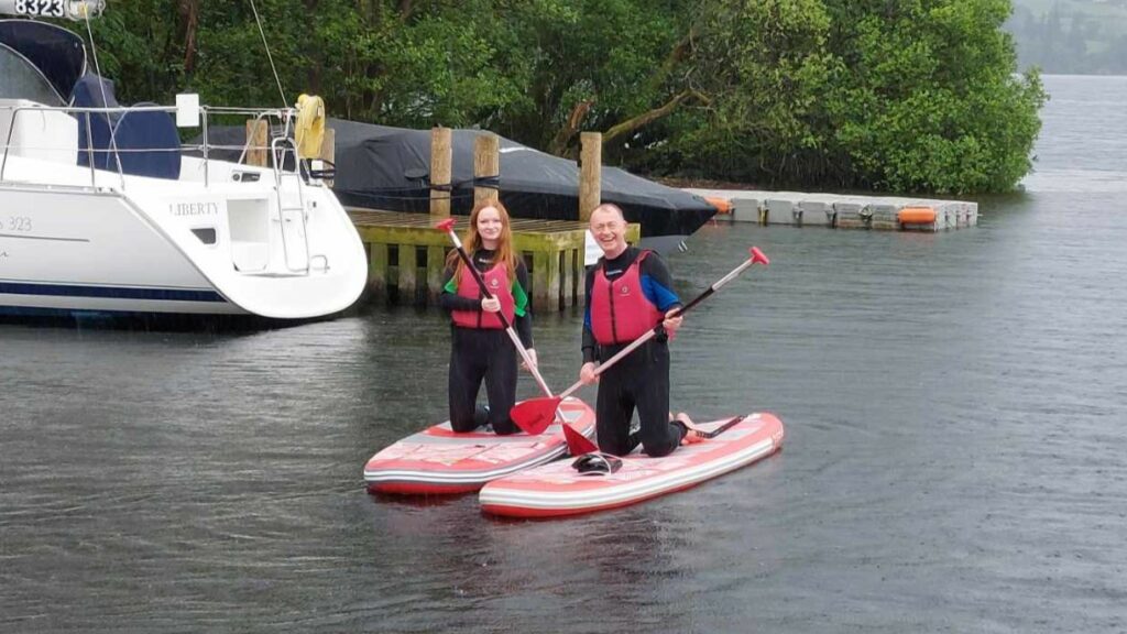 Tim Farron and daughter Gracie paddleboarding at Lake Windermere